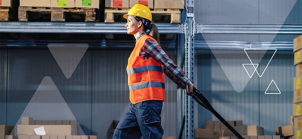 female construction worker pulling a machine