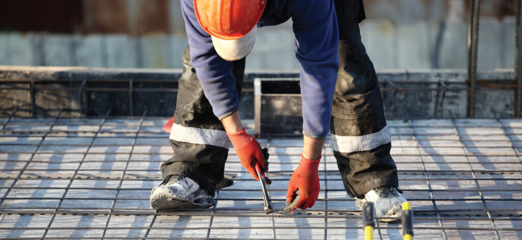 Photo of a construction worker using a snipping tool